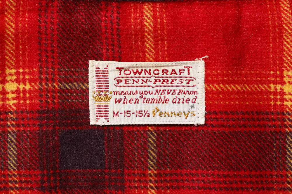 1960〜70年代のPENN-PRESTタグの実物。赤基調でPENN-PRESTの枠囲み表記と王冠が入る